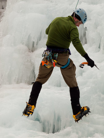 Alpinist ascenting a frozen waterfall in Ice park, Ouray.のeditorial素材