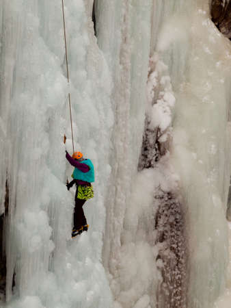 Alpinist ascenting a frozen waterfall in Ice park, Ouray.のeditorial素材
