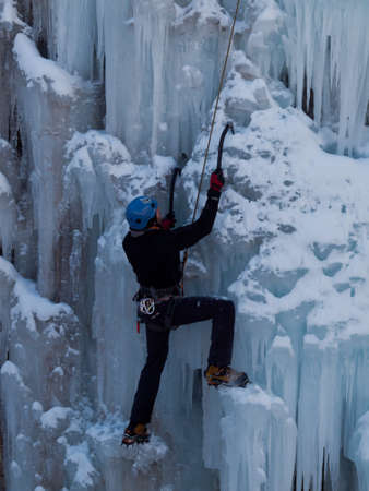Alpinist ascenting a frozen waterfall in Ice park, Ouray.のeditorial素材