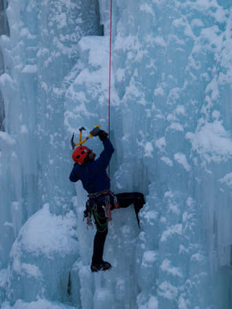 Alpinist ascenting a frozen waterfall in Ice park, Ouray.のeditorial素材