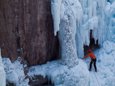 Alpinist ascenting a frozen waterfall in Ice park, Ouray.のeditorial素材