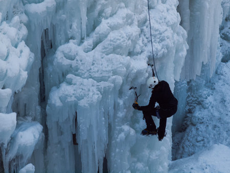 Alpinist ascenting a frozen waterfall in Ice park, Ouray.のeditorial素材