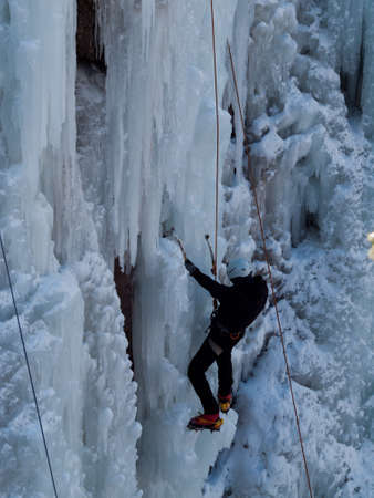Alpinist ascenting a frozen waterfall in Ice park, Ouray.のeditorial素材