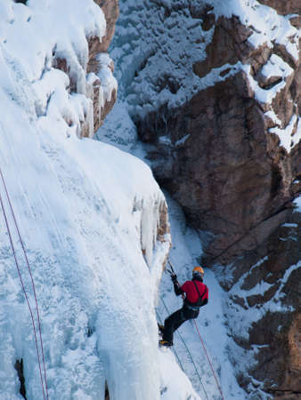 Alpinist ascenting a frozen waterfall in Ice park, Ouray.のeditorial素材