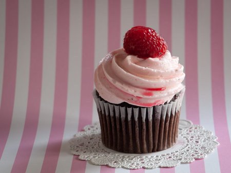 Gourmet cupcake on color backround.の写真素材