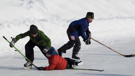 Kids hockey on Evergreen Lake in Evergreen, Colorado.