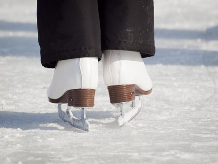 Ice skating on Evergreen Lake in Evergreen, Colorado.