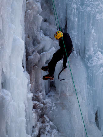 Alpinist ascenting a frozen waterfall in Ice park, Ouray.のeditorial素材