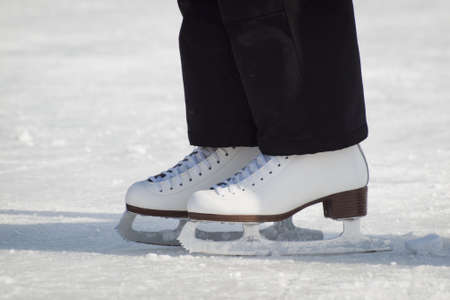 Ice skating on Evergreen Lake in Evergreen, Colorado.のeditorial素材