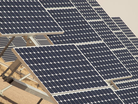 A series of large solar panels forms a symmetrical line at a power plant in the San Luis Valley of...