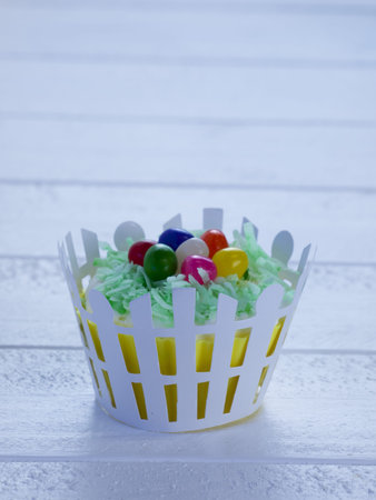 Decorated Easter cupcakes on white table.