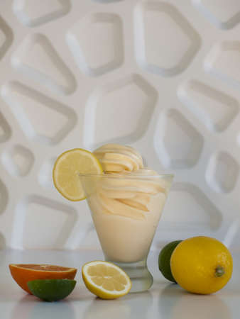 Cup of tropical frozen yogurt with fresh fruit.の写真素材