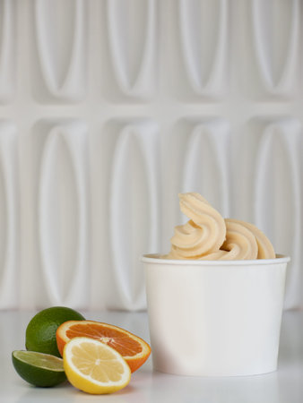 Cup of tropical frozen yogurt with fresh fruit.の写真素材