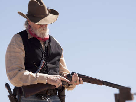 Cowboy Action Shooting Club. The firearms used are based on those which existed in the 19th century American West, i.e. lever action rifle, single action revolver, and shotgun.のeditorial素材