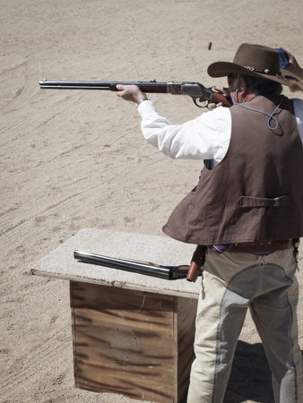 Cowboy Action Shooting Club. The firearms used are based on those which existed in the 19th century American West, i.e. lever action rifle, single action revolver, and shotgun.のeditorial素材
