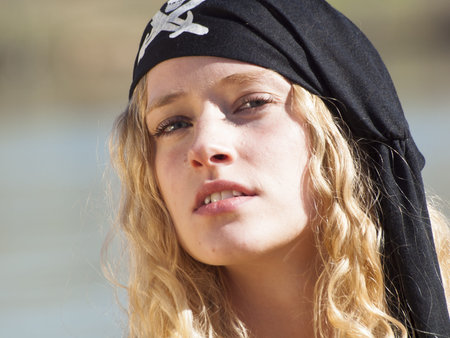 Beautiful young female pirate in red dress.の写真素材