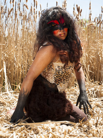 Birdlike people in spring forest.の写真素材