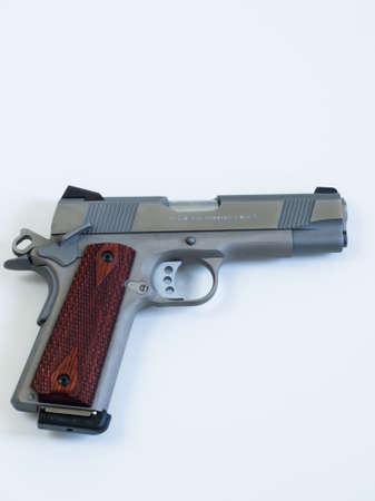 Colt 1911 Commander is a single-action, semi-automatic, magazine-fed, and recoil-operated handgun based on the John M. Browning designed M1911. It was the first mass-produced pistol with an aluminium alloy frame and the first Colt pistol to be chambered iのeditorial素材