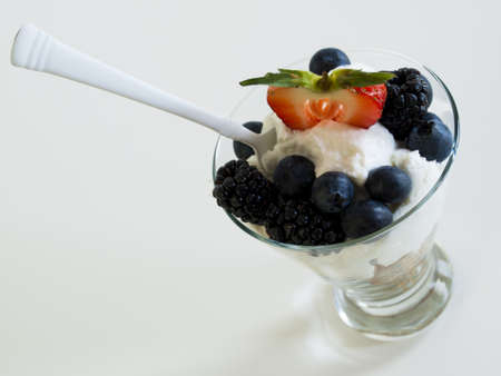 Yogurt parfait with blueberries, blackberries, strawberries, and Granola.の写真素材