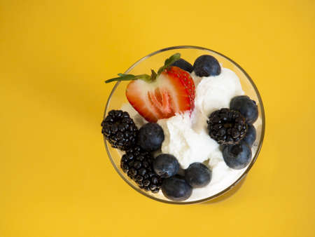 Yogurt parfait with blueberries, blackberries, strawberries, and Granola.の写真素材