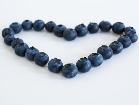 Fresh bluberries from local market on white background. Blueberries contain anthocyanins,  and various phytochemicals, which possibly have a role in reducing risks of some diseases.の写真素材