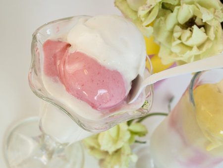 Scoop of delicious Italian fresh ice cream on white background.