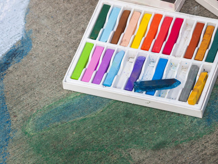 Chalks on the street during Chalk Art Festival in Denver, Colorado.