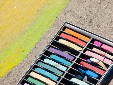 Chalks on the street during Chalk Art Festival in Denver, Colorado.