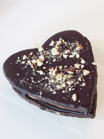 Chocolate cookies with peanut butter filling on white background.の写真素材