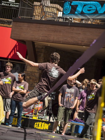 2012 Summer Teva Mountain Games in Vail, Colorado. Slacklining is defined as the act of balancing...