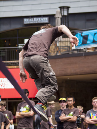 2012 Summer Teva Mountain Games in Vail, Colorado. Slacklining is defined as the act of balancing...