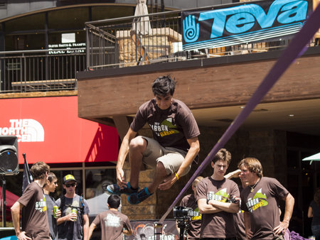 2012 Summer Teva Mountain Games in Vail, Colorado. Slacklining is defined as the act of balancing...