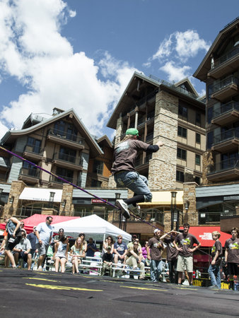 2012 Summer Teva Mountain Games in Vail, Colorado. Slacklining is defined as the act of balancing...