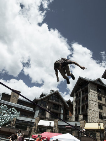 2012 Summer Teva Mountain Games in Vail, Colorado. Slacklining is defined as the act of balancing...