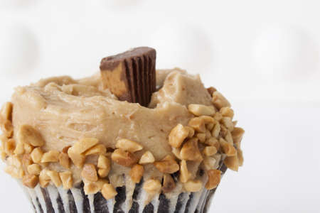 Gourmet Reese's peanut butter cups cupcake on white backround.の写真素材