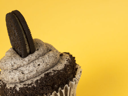 Gourmet Oreo cupcake on yellow backround.