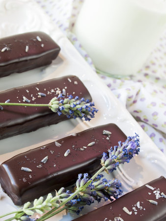 Gourmet lavender chocolate bars on white seving plate.の写真素材