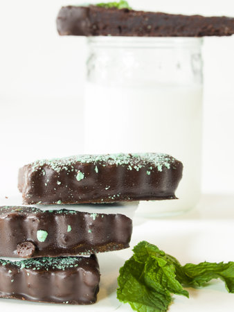 Gourmet mint chocolate bars on white plate.の写真素材