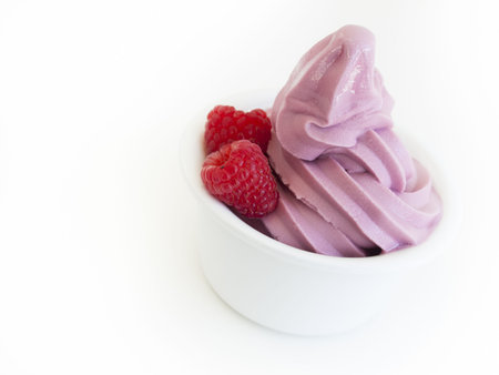 Frozen soft-serve yogurt in cup on white background.の写真素材