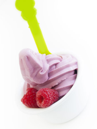 Frozen soft-serve yogurt in cup on white background.の写真素材
