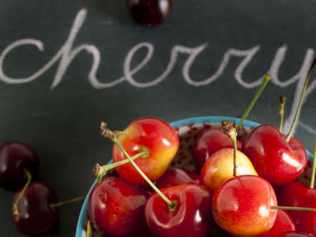 Freshly picked heap of cherries in bowl.の写真素材