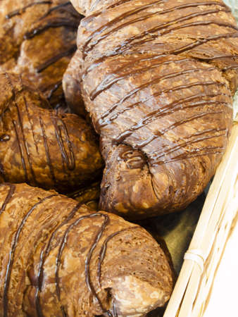 The dough is layered with butter, rolled and folded several times in succession, then rolled into a sheet, in a technique called laminating.の写真素材