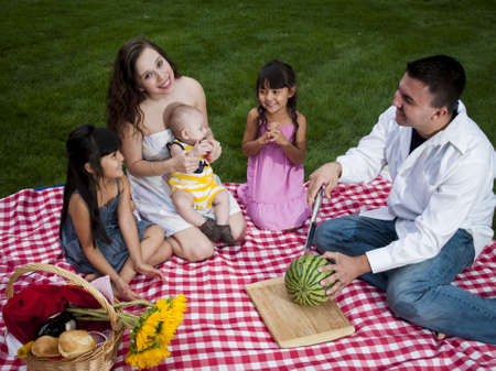 Young family having picnic at the park.の写真素材