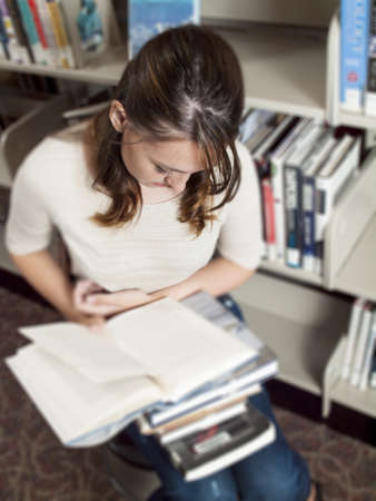 Teenage girl at the library.の写真素材
