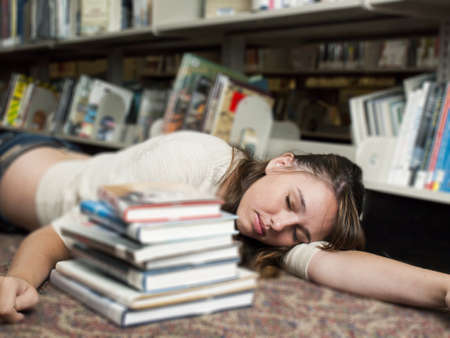 Teenage girl at the library.の写真素材