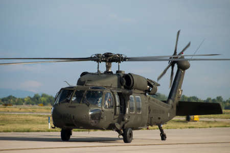 The UH-60 Black Hawk is a four-bladed, twin-engine, medium-lift utility helicopter manufactured by Sikorsky Aircraft. 2012 APW Fly-in Warbirds at Centennial Airport, Centennial, Colorado.のeditorial素材