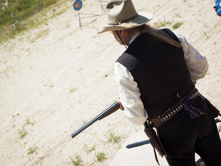 2012 annual match of Colorado Shaketails Cowboy Action Shooting SASS Club.  The firearms used are based on those which existed in the 19th century American West, i.e. lever action rifle, single action revolver, and shotgun.の写真素材