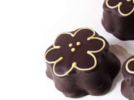 Gourmet chocolate covered passion fruit marshmallows on white background.の写真素材