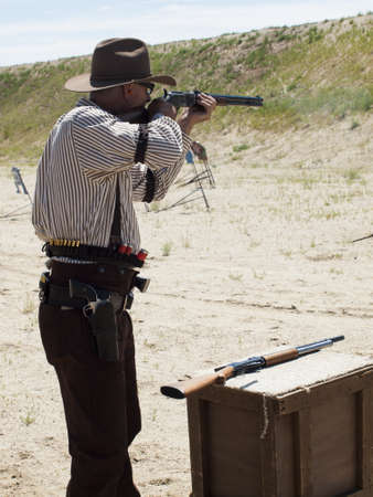 2012 annual match of Colorado Shaketails Cowboy Action Shooting SASS Club.  The firearms used are based on those which existed in the 19th century American West, i.e. lever action rifle, single action revolver, and shotgun.のeditorial素材