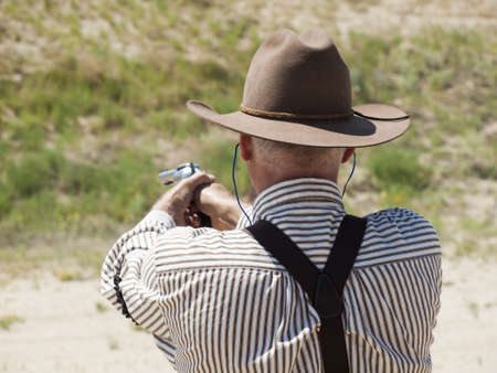 2012 annual match of Colorado Shaketails Cowboy Action Shooting SASS Club.  The firearms used are based on those which existed in the 19th century American West, i.e. lever action rifle, single action revolver, and shotgun.のeditorial素材